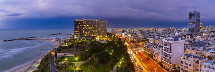 Elevated view of the beaches and hotels at dusk, Jaffa visible in the background, Tel Aviv, Israel, Middle East - RHPLF07071