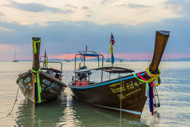 Long tail boats at sunset on Railay beach in Railay, Ao Nang, Krabi Province, Thailand, Southeast Asia, Asia - RHPLF07359