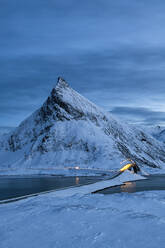 Fredvang Bridge set against pyramid shaped mountain at night with light trails, Lofoten, Arctic, Norway, Europe - RHPLF07392