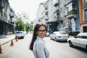 Portait of happy young businesswoman on the street - OYF00047