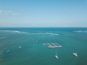 Aerial view of seascape against blue sky, Bali, Indonesia - KNTF03326