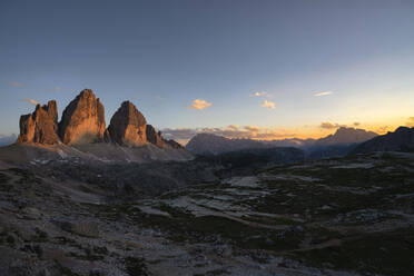 Scenic view of Tre Cime Di Lavaredo against sky at sunset, Italy - LOMF00893