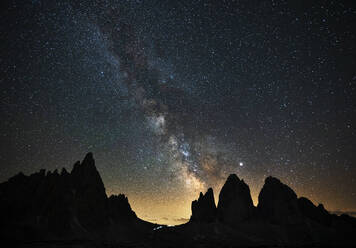 Scenic view of silhouette Tre Cime Di Lavaredo against star field at night, Veneto, Italy - LOMF00895