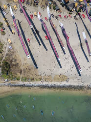 Drone view of kites flying at beach during festival in Bali, Indonesia - KNTF03346