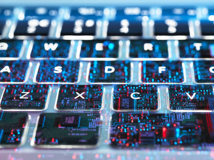 Double exposure of a laptop computer showing electronic components under the keyboard - ABRF00588
