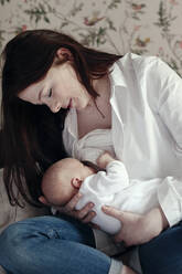 Woman breastfeeding her baby son - EYAF00439