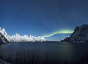 Panorama of the Northern Lights on the Senjahopen peak surrounded by the frozen sea, Senja, Mefjordbotn, Troms county, Norway, Scandinavia, Europe - RHPLF08062