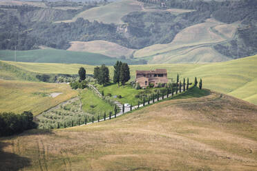 Green rolling hills and farm houses of Crete Senesi (Senese Clays), Province of Siena, Tuscany, Italy, Europe - RHPLF08284