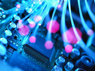 Fibre optics carrying data passing across electronic circuit board - ABRF00609