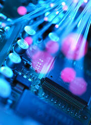 Fibre optics carrying data passing across electronic circuit board - ABRF00610