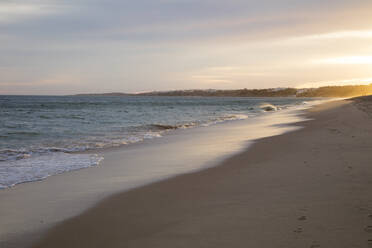 Scenic view of beach against sky during sunset, Atlantic Coast, Algarve, Portugal - WIF04007