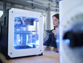 Woman and 3D printer on table - CVF01484