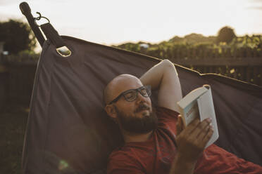 Man relaxing in hammock - JOHF00057