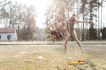 Cheerful kids playing with water - JOHF00109