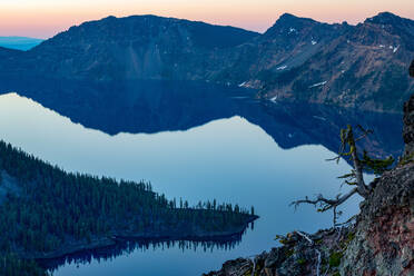 Wizard Island and the still waters of Crater Lake at dawn, the deepest lake in the U.S.A., part of the Cascade Range, Oregon, United States of America, North America - RHPLF08689