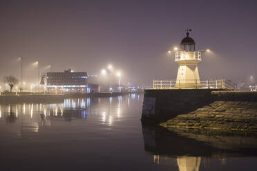 Lighthouse at harbor entrance in Malmo, Sweden at night - FOLF10486