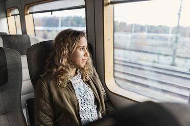 Young woman commuter on train - FOLF10655