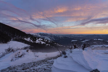 Scenic view of snow covered mountains against sky during sunrise, Umbria, Italy - LOMF00903