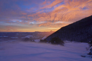 Scenic view of snow covered mountains at cloudy sky during sunrise, Umbria, Italy - LOMF00904