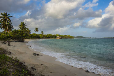 Scenic view of Petit Carenage Bay against cloudy sky at Carriacou, Grenada, Caribbean - RUNF02964