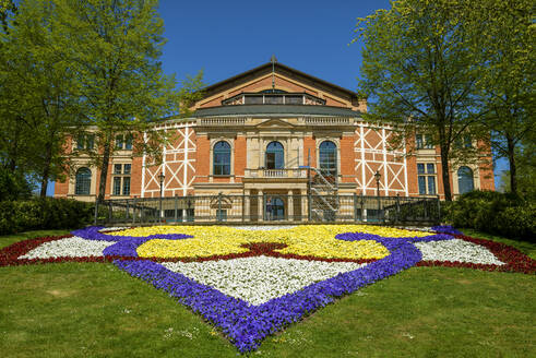 Colorful flowers in front of Bayreuth Festspielhaus during sunny day, Bayreuth, Germany - LBF02706