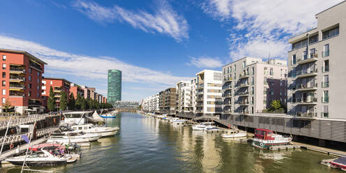 Boats on River Main amidst buildings against sky, Frankfurt, Hesse, Germany - WDF05482