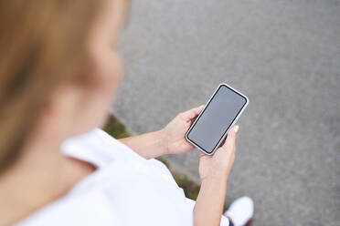 Close-up of woman using smartphone outdoors - BSZF01447