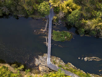 Aerial view of bridge over river at Bali, Indonesia - KNTF03357