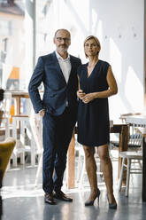 Portrait of confident businessman and woman - KNSF06348