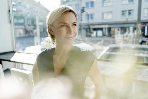 Smiling businesswoman in a cafe stock photo