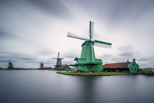 De Gekroonde Poelenburg by Zaan river against sky at Zaanse Schans, Zaandam, Netherlands - XCF00201