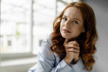 Portrait of redheaded businesswoman in a loft - KNSF06447