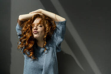 Portrait of redheaded woman pouting mouth - KNSF06460