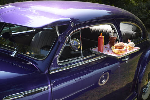 Typical American fast food on tray at vintage car, Chevrolet Fleetline - BSCF00610