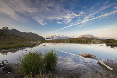 The clear sky is reflected in the blue alpine lake, Muottas Muragl, Samedan, Canton of Graubunden, Engadine, Switzerland, Europe - RHPLF08824