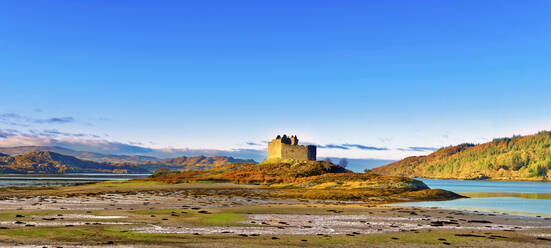 Castle Tioram on the coastal island Eilean Tioram where River Shiel and Loch Moidart meet, at low tide on a sunny winter morning, Highlands, Scotland, United Kingdom, Europe - RHPLF08908