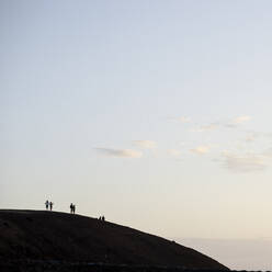 Silhouette of people on hill - FOLF11015