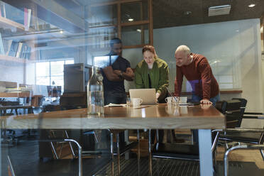 View through window of businesspeople in meeting - FOLF11203