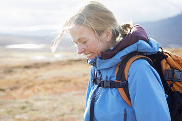 Woman smiling during hike - FOLF11288