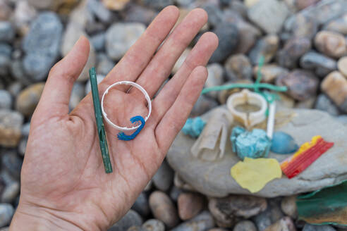 Woman's hand with plastic waste - AFVF03944
