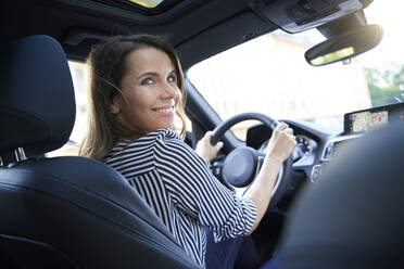 Happy woman driving car - PNEF01973
