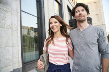 Happy couple in the city on the move - PNEF02050