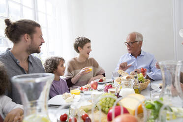 Happy extended family having lunch at home - MJFKF00113