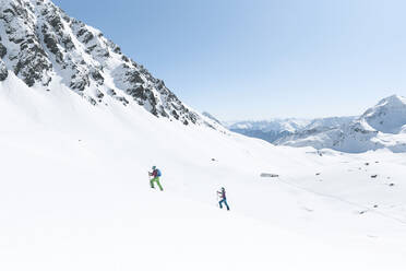Couple ski touring in the mountains, Kuehtai, Tyrol, Austria - CVF01497