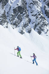 Couple ski touring in the mountains, Kuehtai, Tyrol, Austria - CVF01498