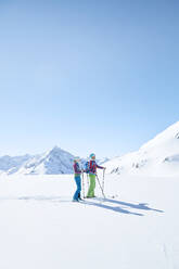 Couple of ski tourers having a break in the mountains, Kuehtai, Tyrol, Austria - CVF01502