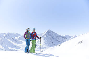 Couple of ski tourers having a break in the mountains, Kuehtai, Tyrol, Austria - CVF01503