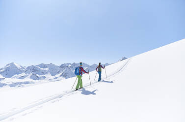 Couple ski touring in the mountains, Kuehtai, Tyrol, Austria - CVF01504