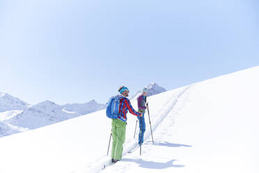 Couple ski touring in the mountains, Kuehtai, Tyrol, Austria - CVF01505