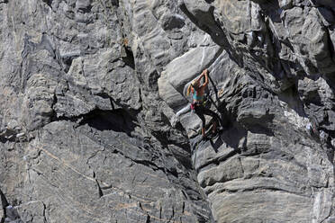 Rock climber in action at Flatanger, Trondelag, Norway, Scandinavia, Europe - RHPLF09195